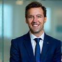 Professional solicitor smiling in a bright office environment